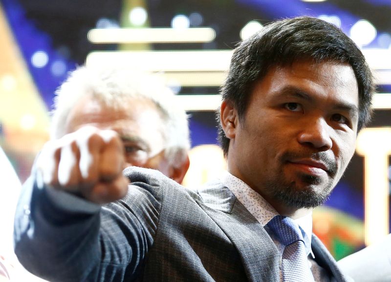 Philippine boxing icon Manny "Pacman" Pacquiao poses for photographers during a news conference in Kuala Lumpur, Malaysia, on April 20, 2018. Pacquiao has announced his run for president.