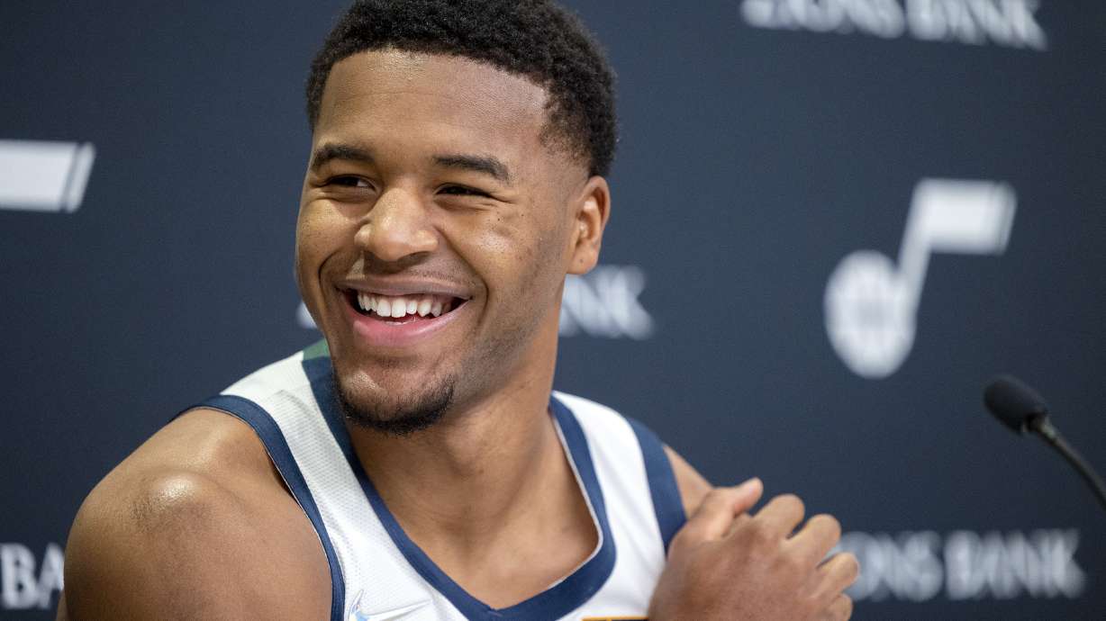 Utah Jazz guard Jared Butler (13) turns his head while laughing at an interview during the Utah Jazz media media day at Vivint Arena in Salt Lake City on Monday, Sept. 27, 2021.