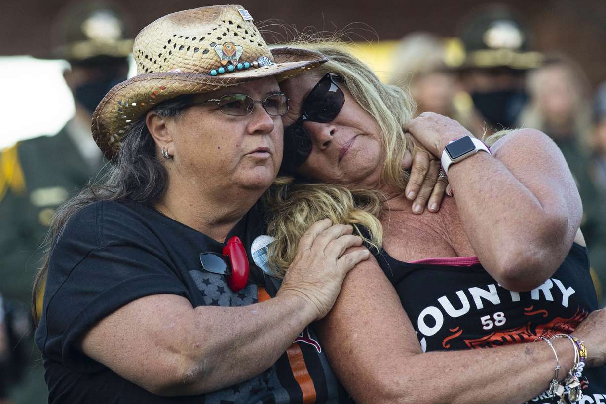 Route 91 Harvest festival shooting survivors Sue Ann Cornwell, left, of North Las Vegas, and Alicia Mierke of Henderson attend the annual 1 October Remembrance Ceremony at the Clark County Government Center on Friday, in Las Vegas.