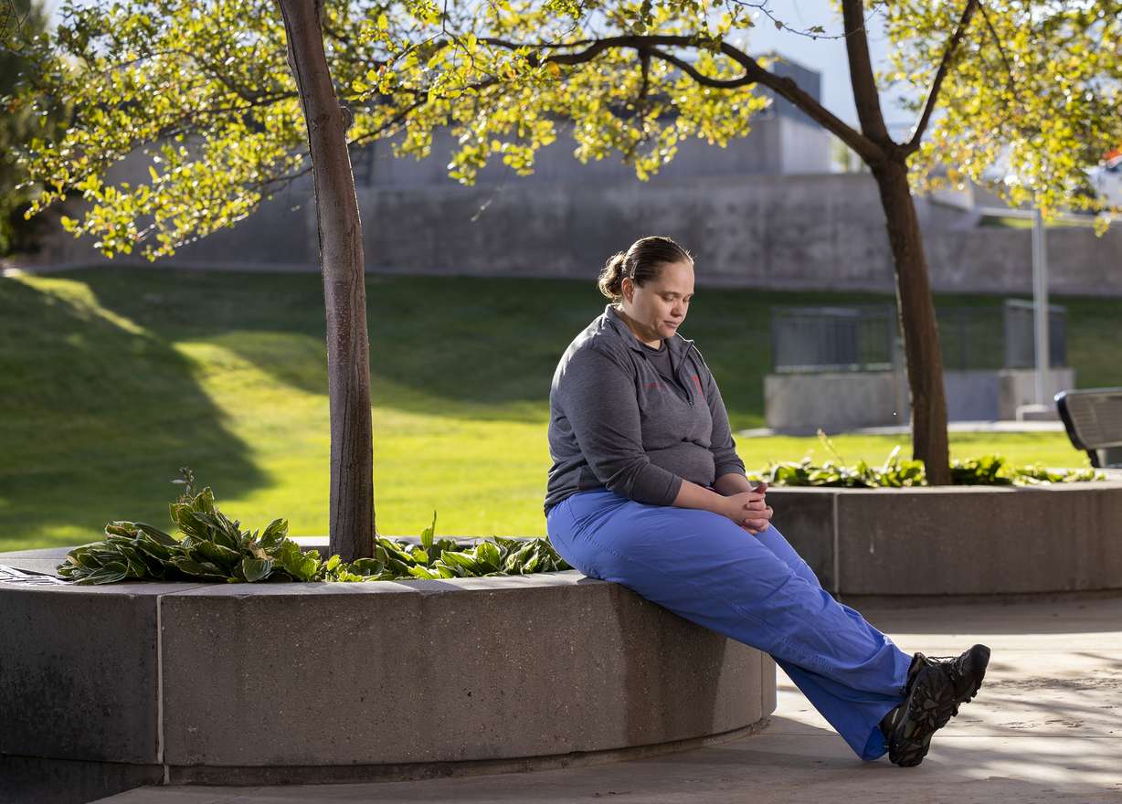 Lori Green, a respiratory therapist at University of Utah Health who works with COVID-19 patients, poses for photos outside of the University of Utah Hospital in Salt Lake City on Friday.