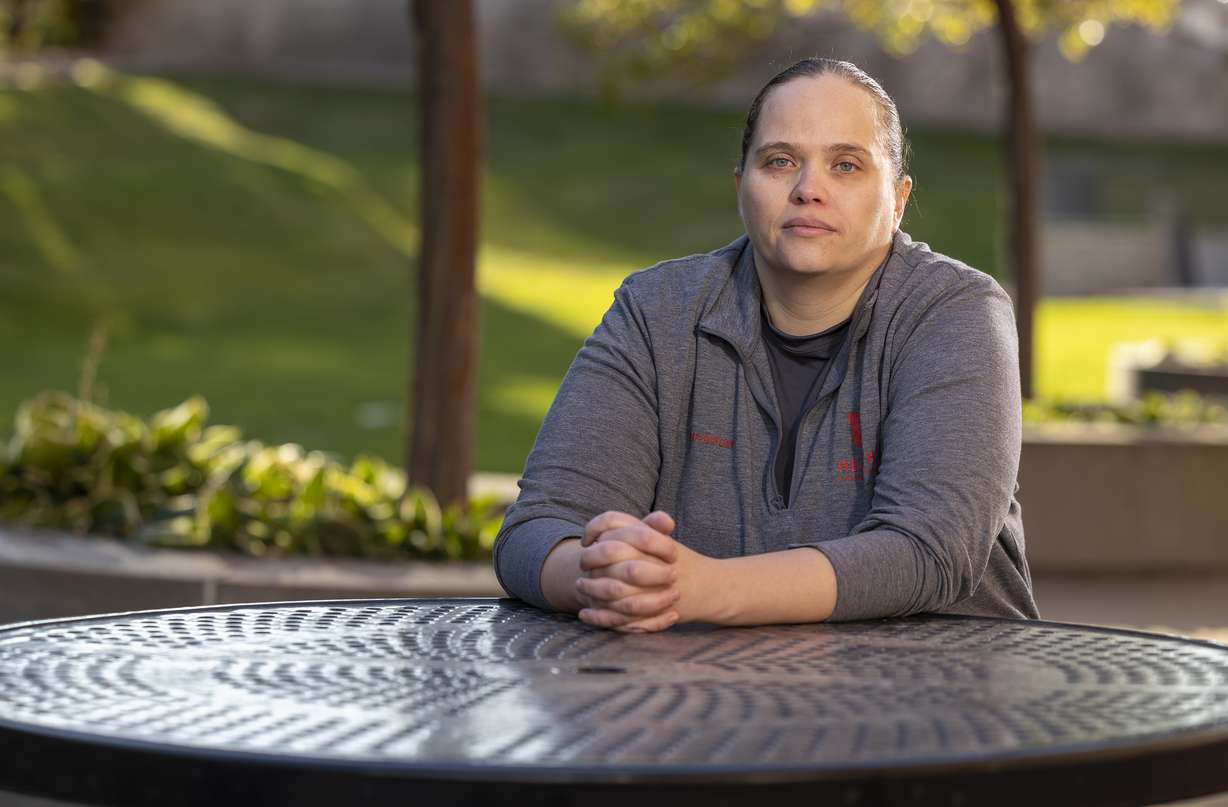 Lori Green, a respiratory therapist at University of Utah Health who works with COVID-19 patients, poses for photos outside of the University of Utah Hospital in Salt Lake City on Friday.