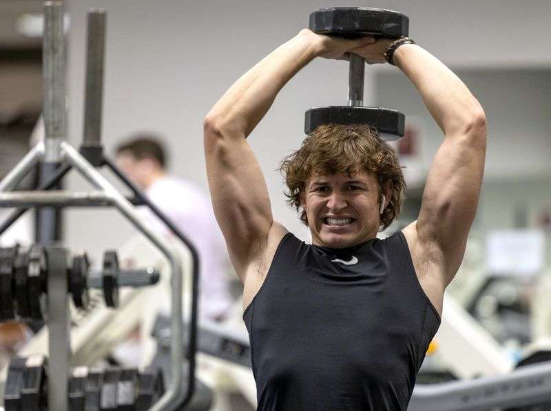 Cody Strong, a senior at Corner Canyon High School,
works out at Treehouse Athletic Club in Draper on Wednesday. Cody battled COVID-19 and is on the
comeback.