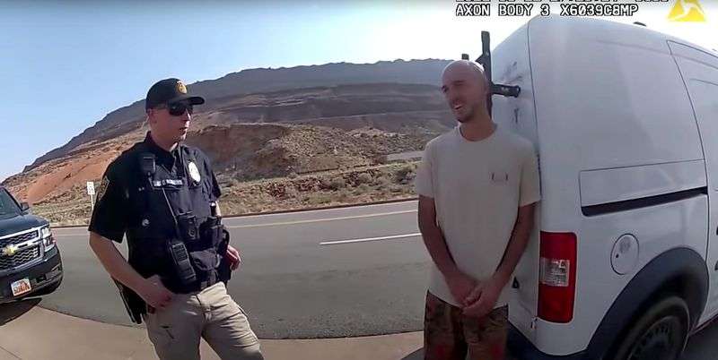 Newly released police body camera video provided by the
Moab Police Department shows Brian Laundrie, right, talking to a
police officer on Aug. 12, 2021. Police pulled over the van he was
traveling in with his girlfriend, Gabrielle "Gabby” Petito, near
the entrance to Arches National Park.
