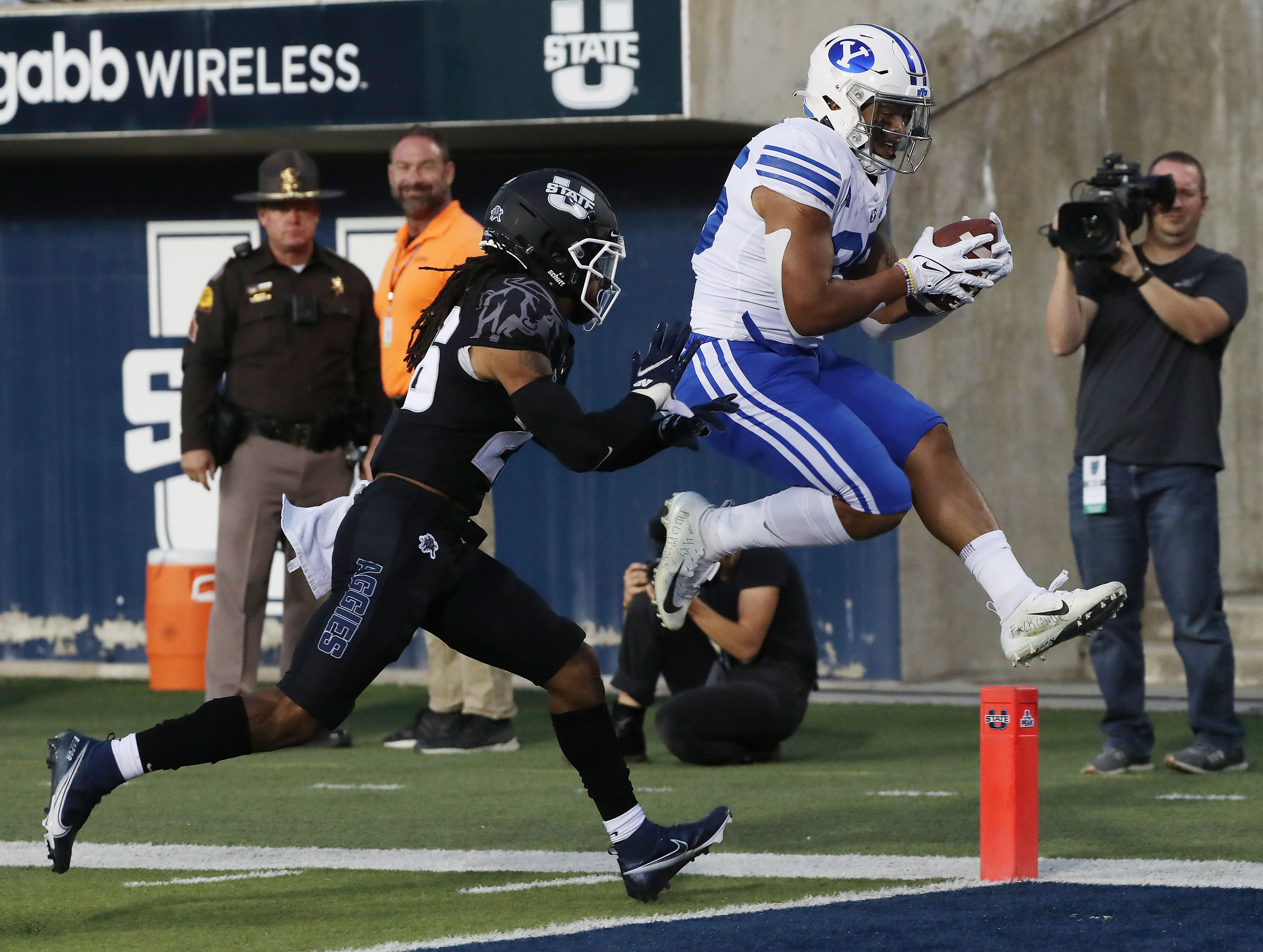 BYU running back Tyler Allgeier scores on Utah State Aggies in Logan on Friday, Oct. 1, 2021.