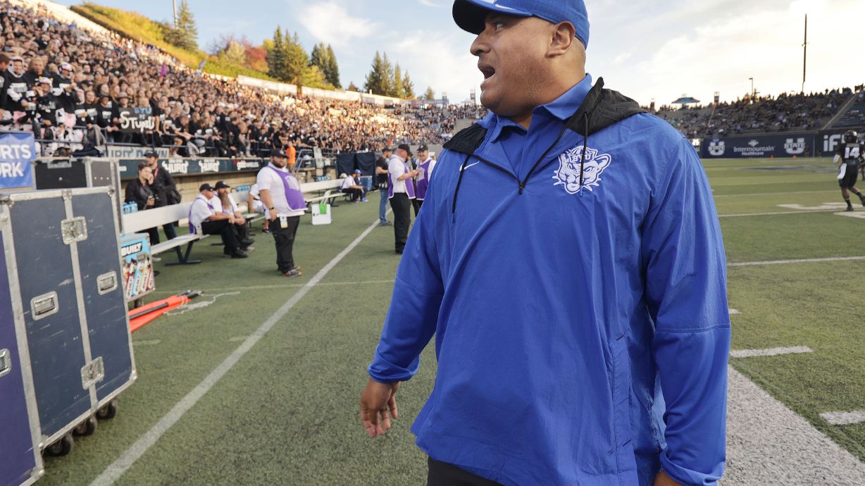 Brigham Young Cougars head coach Kalani Sitake talks with Aggie fans in Logan on Friday, Oct. 1, 2021.