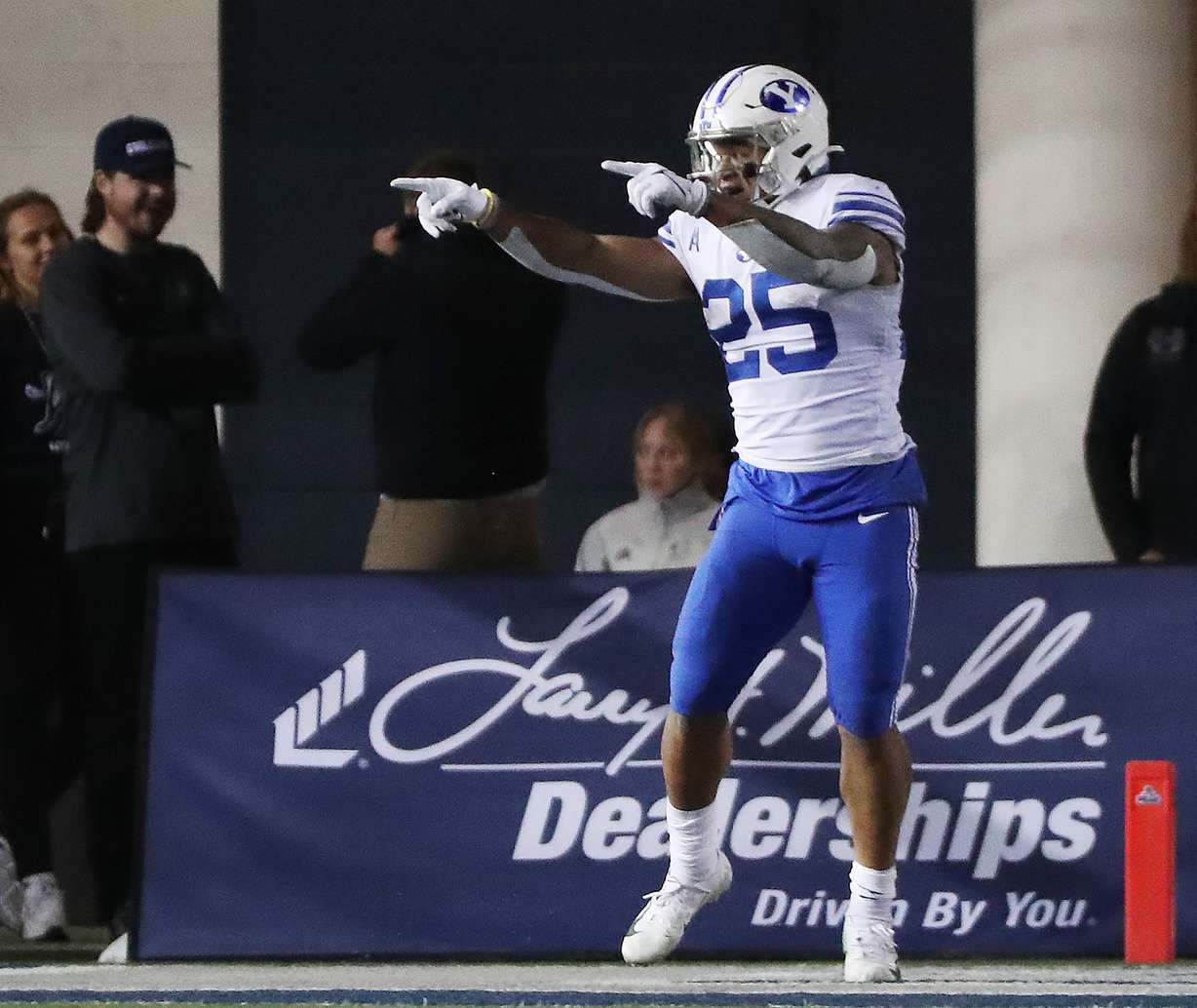 Brigham Young Cougars running back Tyler Allgeier celebrates what he thought was a touchdown against the Utah State Aggies in Logan on Friday, Oct. 1, 2021. He was downed at the 1-yard line but scored later.