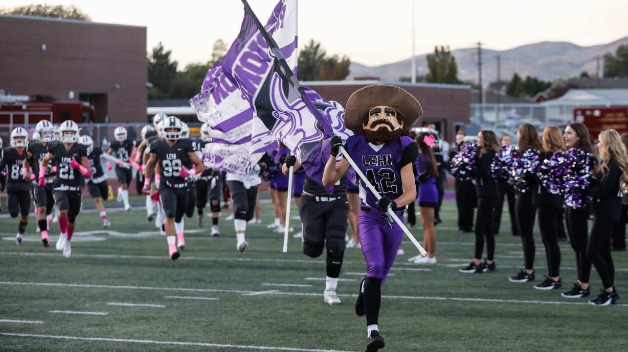 Lehi players take the field ahead of a game against Alta at Lehi High School in Lehi on Friday, Oct. 1, 2021.