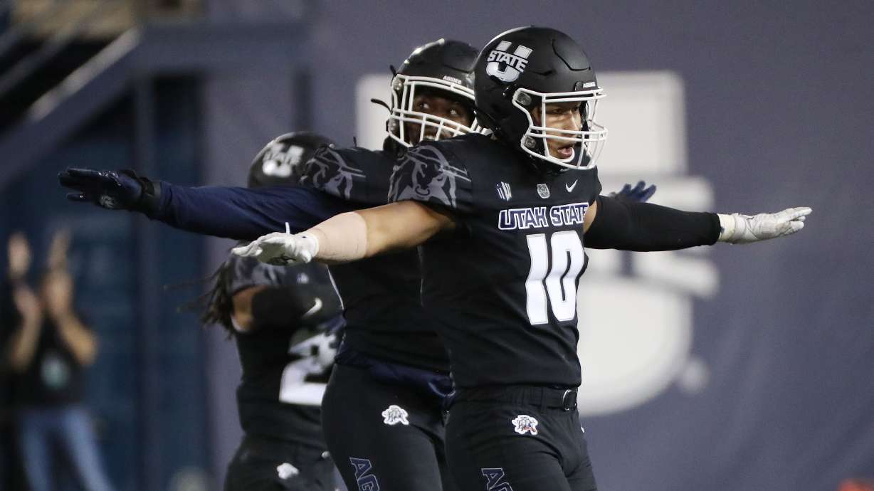Utah State Aggies linebacker AJ Vongphachanh (10) celebrates a missed Brigham Young Cougars field goal in Logan on Friday, Oct. 1, 2021.