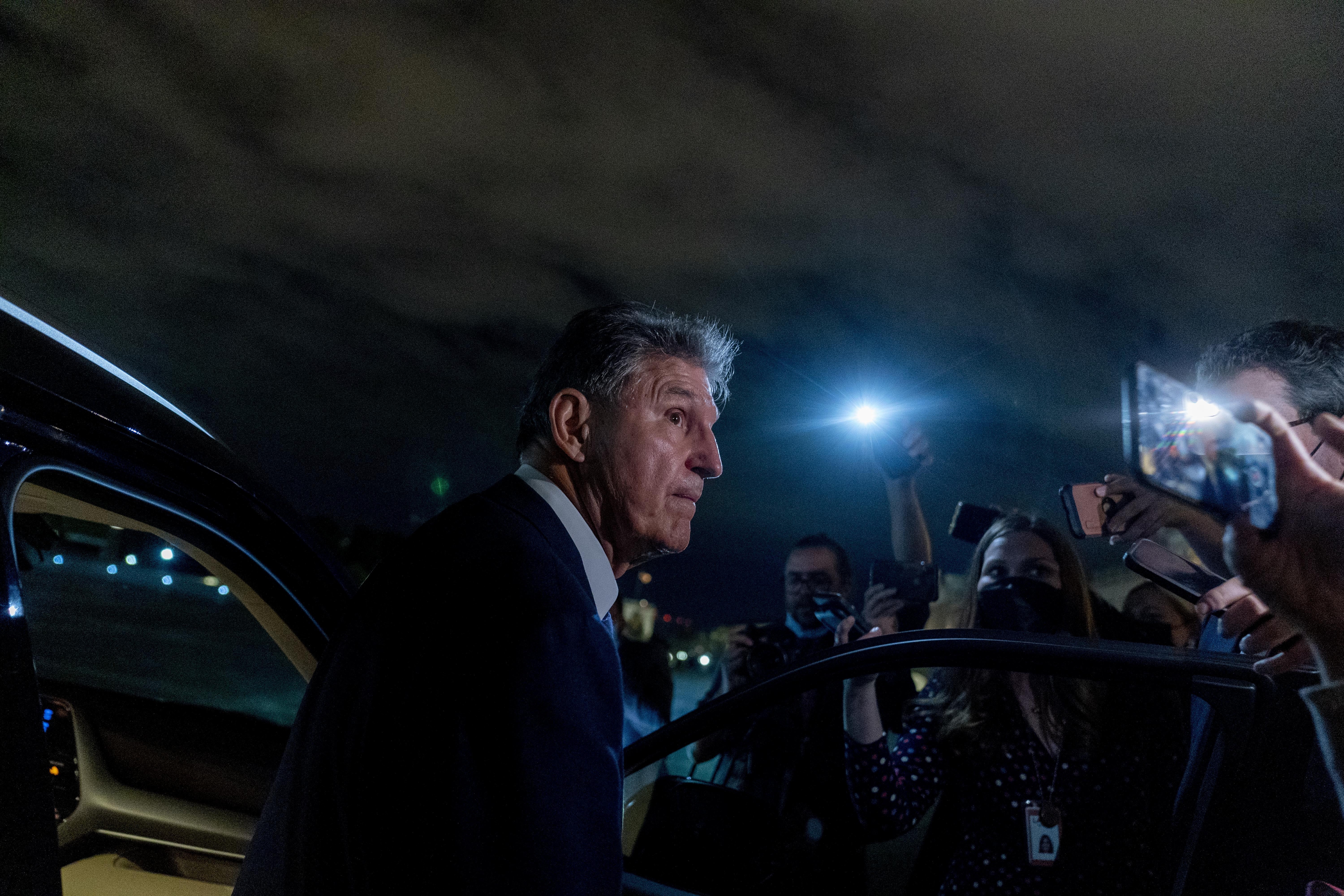 Sen. Joe Manchin, D-W.Va., speaks to reporters as he leaves a private meeting with Sen. Kyrsten Sinema, D-Ariz., and White House officials on Capitol Hill in Washington Sept. 30.