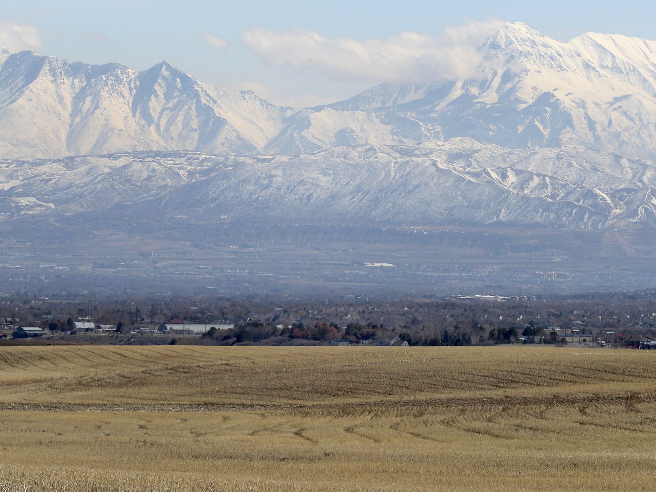 Land between 6300 West and 8500 West and 12400 South and 13100 South in unincorporated Salt Lake County, foreground, is pictured on March 11, 2019. The massive, controversial development in southwest Salt Lake County known as Olympia Hills is back.