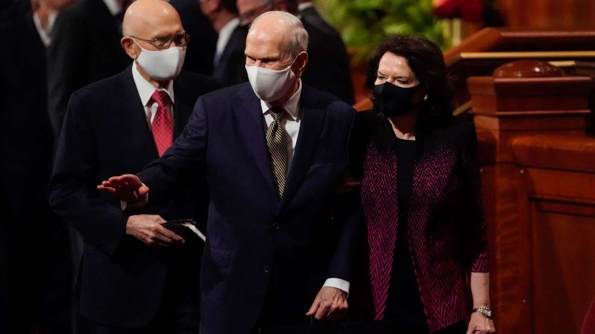 President Russell M. Nelson, president of The Church of Jesus Christ of Latter-day Saints, with his wife, Sister Wendy Nelson, wave toward the audience while exiting the Saturday night session of the 191st Semiannual General Conference at the Conference Center in Salt Lake City on Saturday.