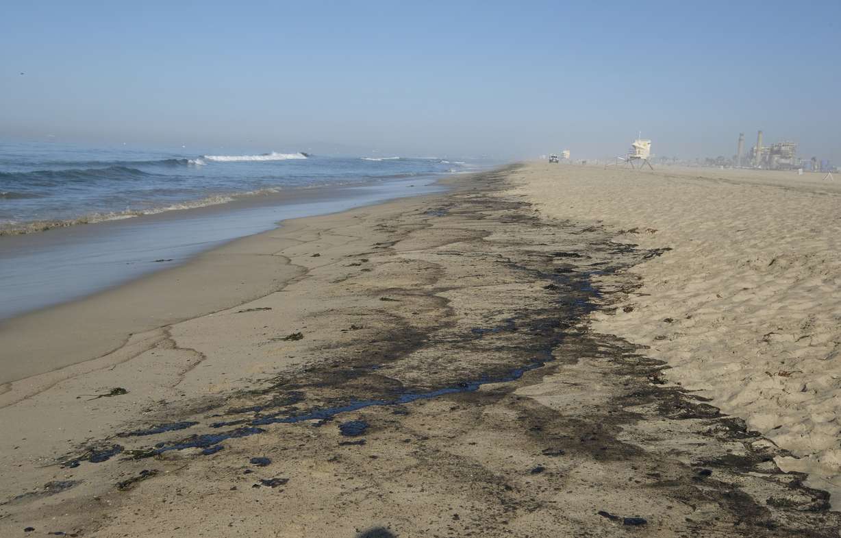 Oil washed up on Huntington Beach, Calif., on Sunday. A major oil spill off the coast of Southern California fouled popular beaches and killed wildlife while crews scrambled Sunday, to contain the crude before it spread further into protected wetlands.