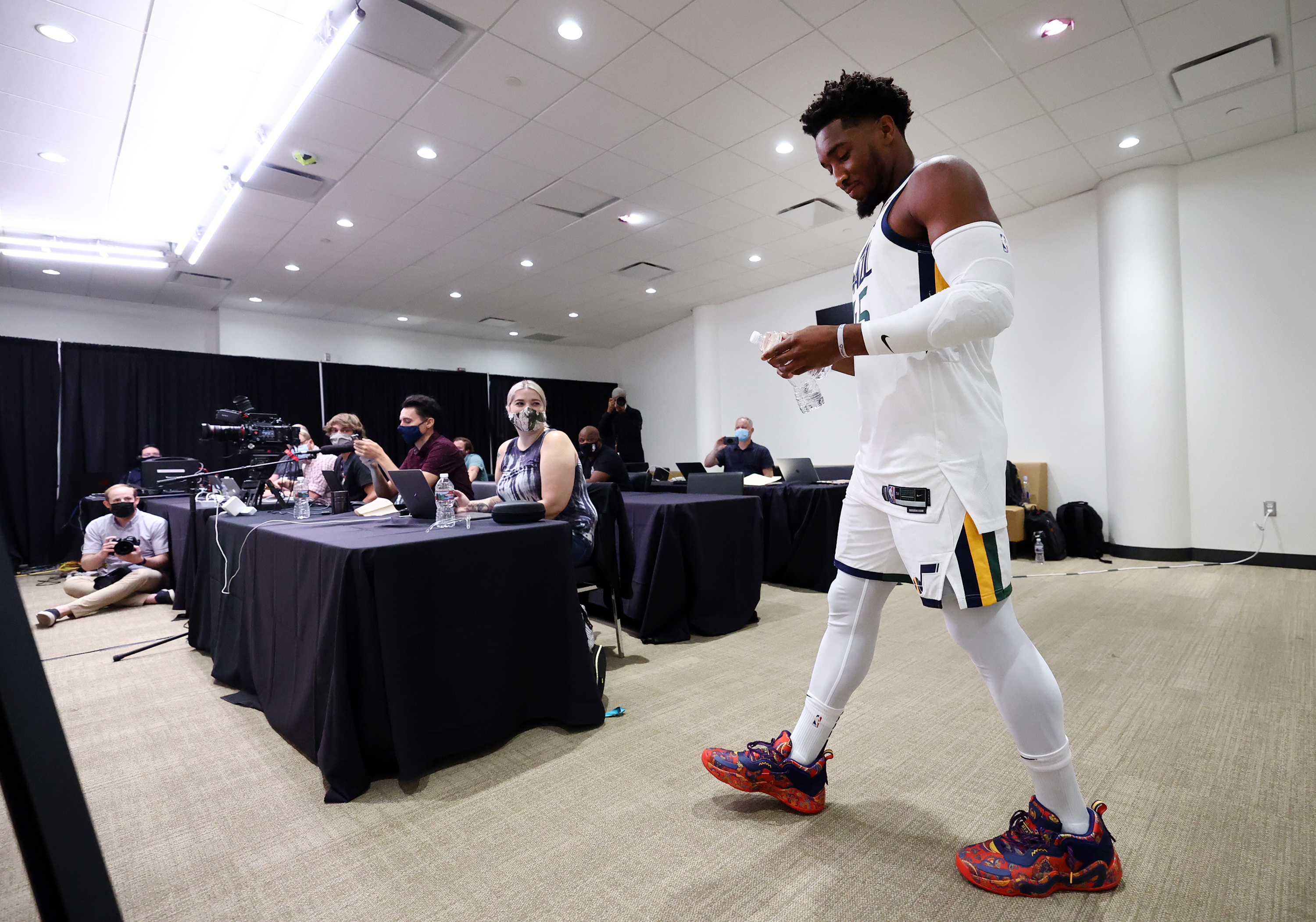Utah Jazz guard Donovan Mitchell (45) walks in for an interview during the Utah Jazz media media day at Vivint Arena in Salt Lake City on Monday, Sept. 27, 2021.