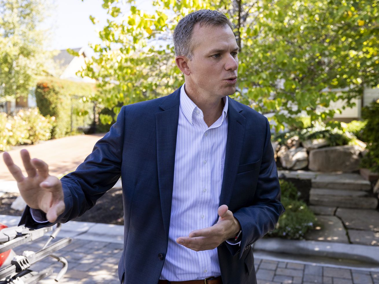 Rep. Blake Moore, R-Utah, who was hoping to welcome Rep. Liz Cheney, R-Wyo., to a fundraiser for his campaign in
Salt Lake City on Monday, talks during a quick interview after Cheney’s plane was apparently delayed, causing her
to miss the event.