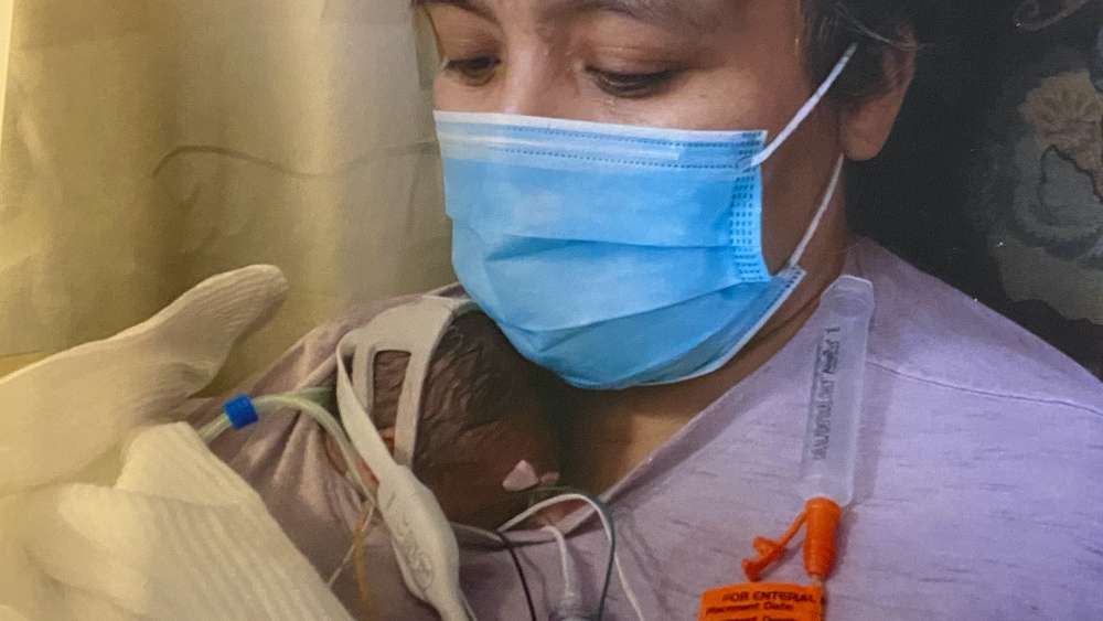 Nancy Hernandez holds her daughter Angelica.