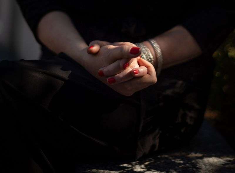 Sharon Weeks clasps her hands tightly while speaking
about the killing of her sister and niece to journalists at the
Capitol in Salt Lake City on Sept. 15. Weeks’
sister, Brenda Lafferty, and Brenda’s 15-month-old daughter, Erica,
were killed by brothers Ron and Dan Lafferty, Brenda’s
brothers-in-law, in 1984.