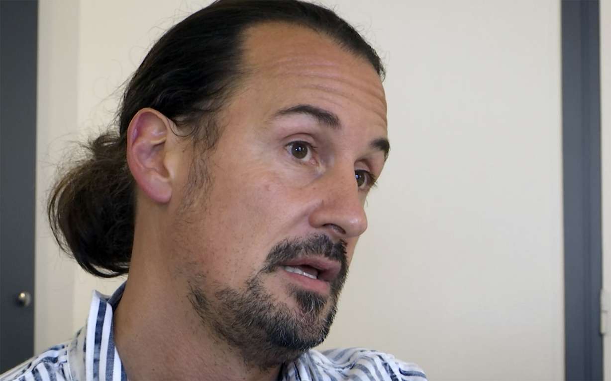 Olivier Savignac, President of "Parler et revivre" (Speak out and live again) victims association speaks during an interview Monday in Paris.