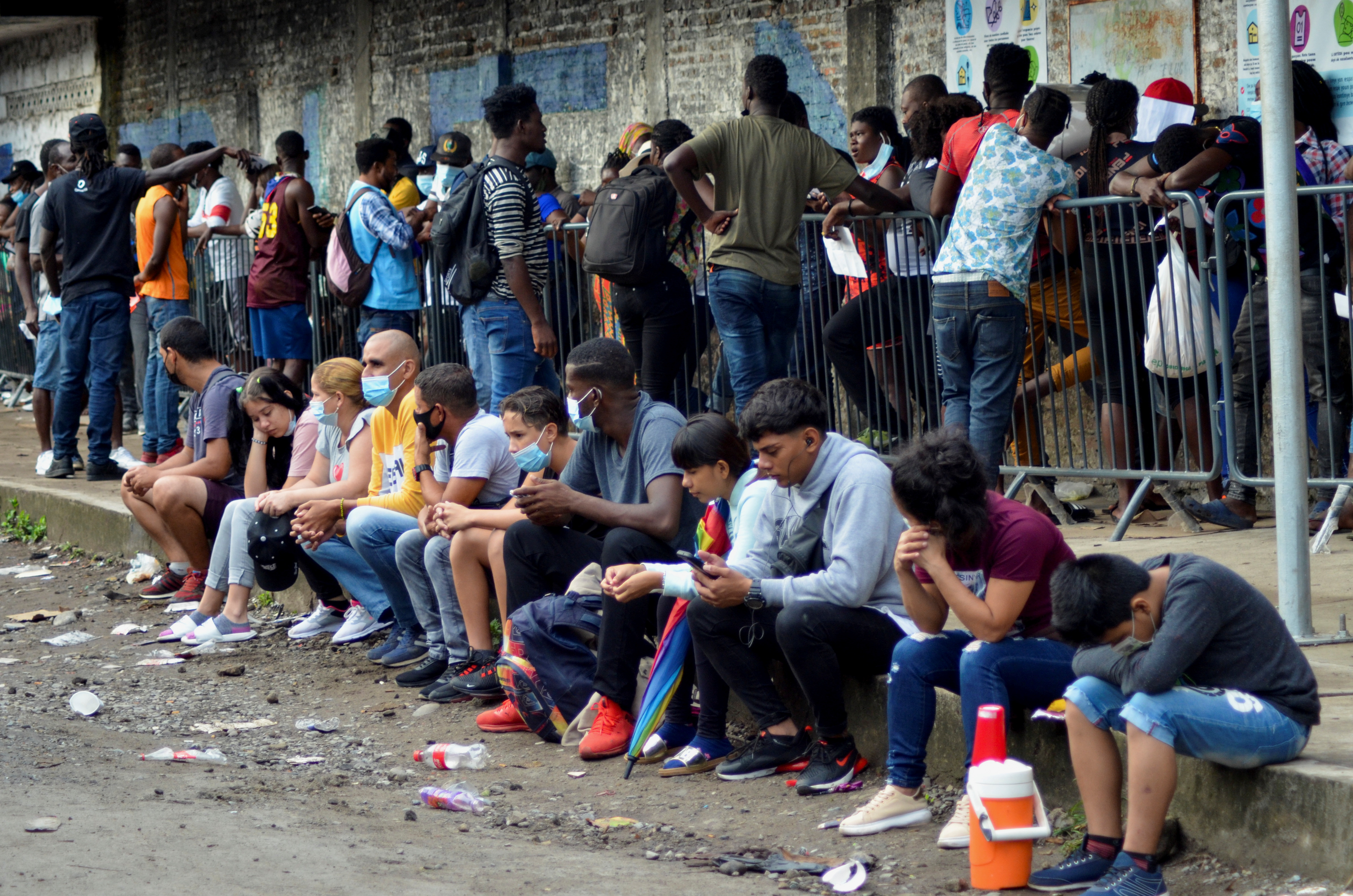 Migrants from Central America, Haiti and Cuba queue outside the Mexican Commission for Refugee Assistance to apply for asylum and refugee status in Mexico, in Tapachula, Mexico, on May 6.