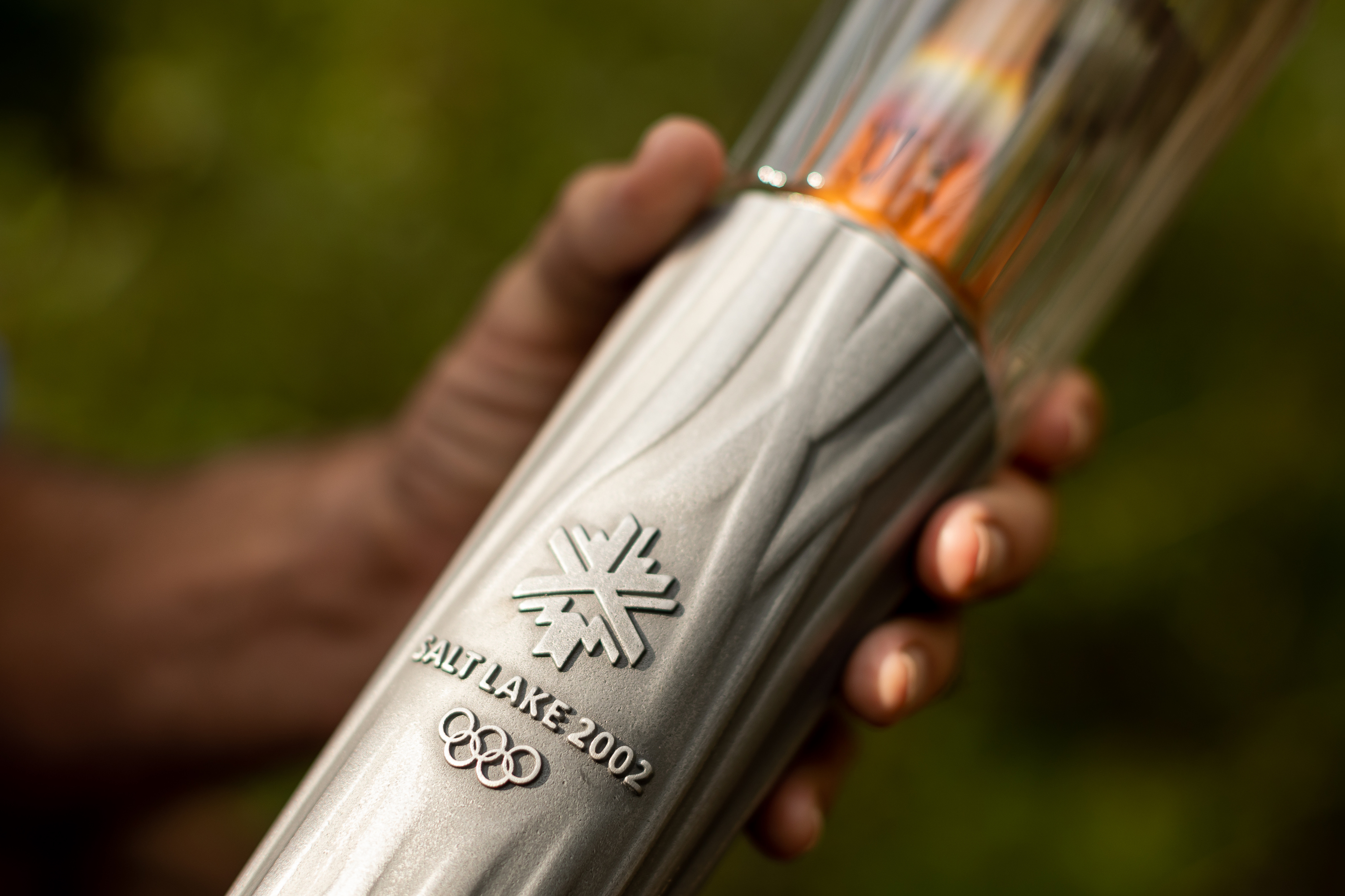 Fraser Bullock, who served as chief operating officer for the Salt Lake Organizing Committee for the 2002 Winter Olympics, holds one of that year’s Olympic torches while he poses for a photograph at his home in Alpine on Aug. 31.
