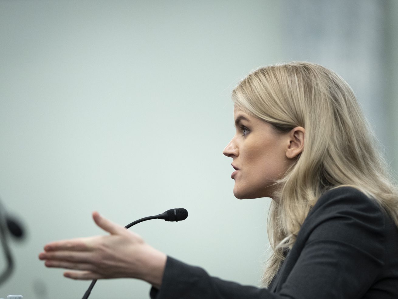 Former Facebook employee and whistleblower Frances Haugen testifies during a Senate Committee on Commerce, Science,
and Transportation hearing on Capitol Hill on Tuesday in Washington, where Utah Sen. Mike Lee presented evidence he said showed Facebook is simply failing to catch harmful ad content targeting children.