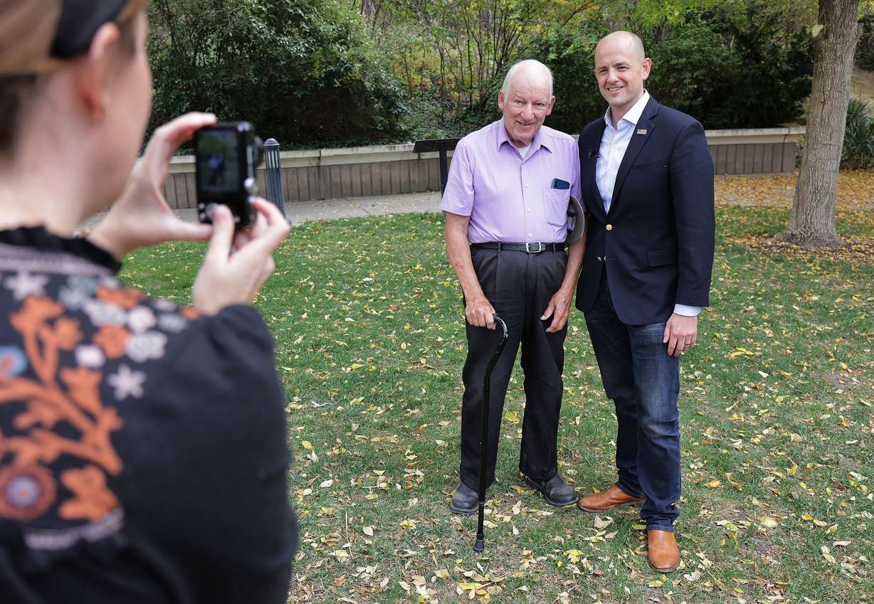 Evan McMullin, right, has a photo taken with Arnold Thayer in Salt Lake City on Tuesday, Oct. 5, 2021. McMullin is running for Sen. Mike Lee's seat as an independent.
