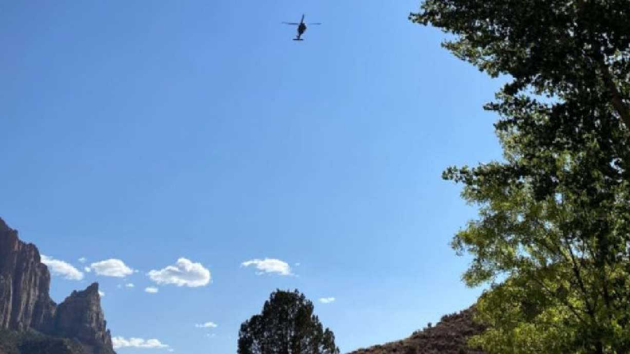 A Nellis Air Force Base helicopter leaves Zion National Park after crews rescue John Fiske Burg on Saturday.