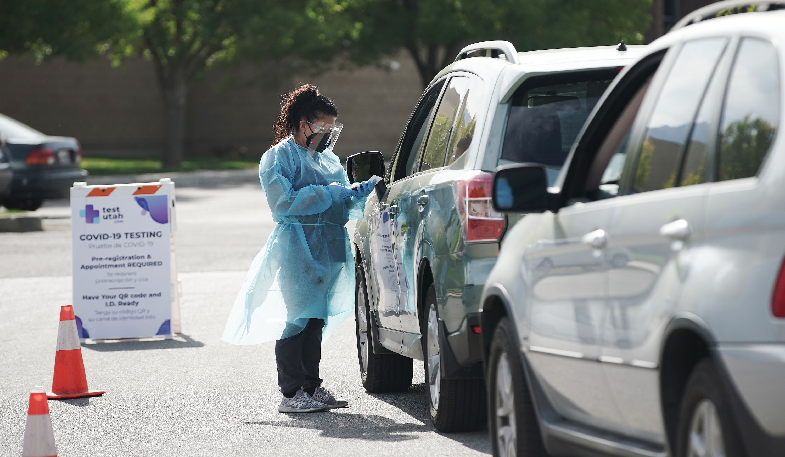 COVID-19 testing is performed at the Mount Olympus Senior Center parking lot in Millcreek on Tuesday. Utah health officials reported 1,975 new COVID-19 cases and 12 deaths on Wednesday.