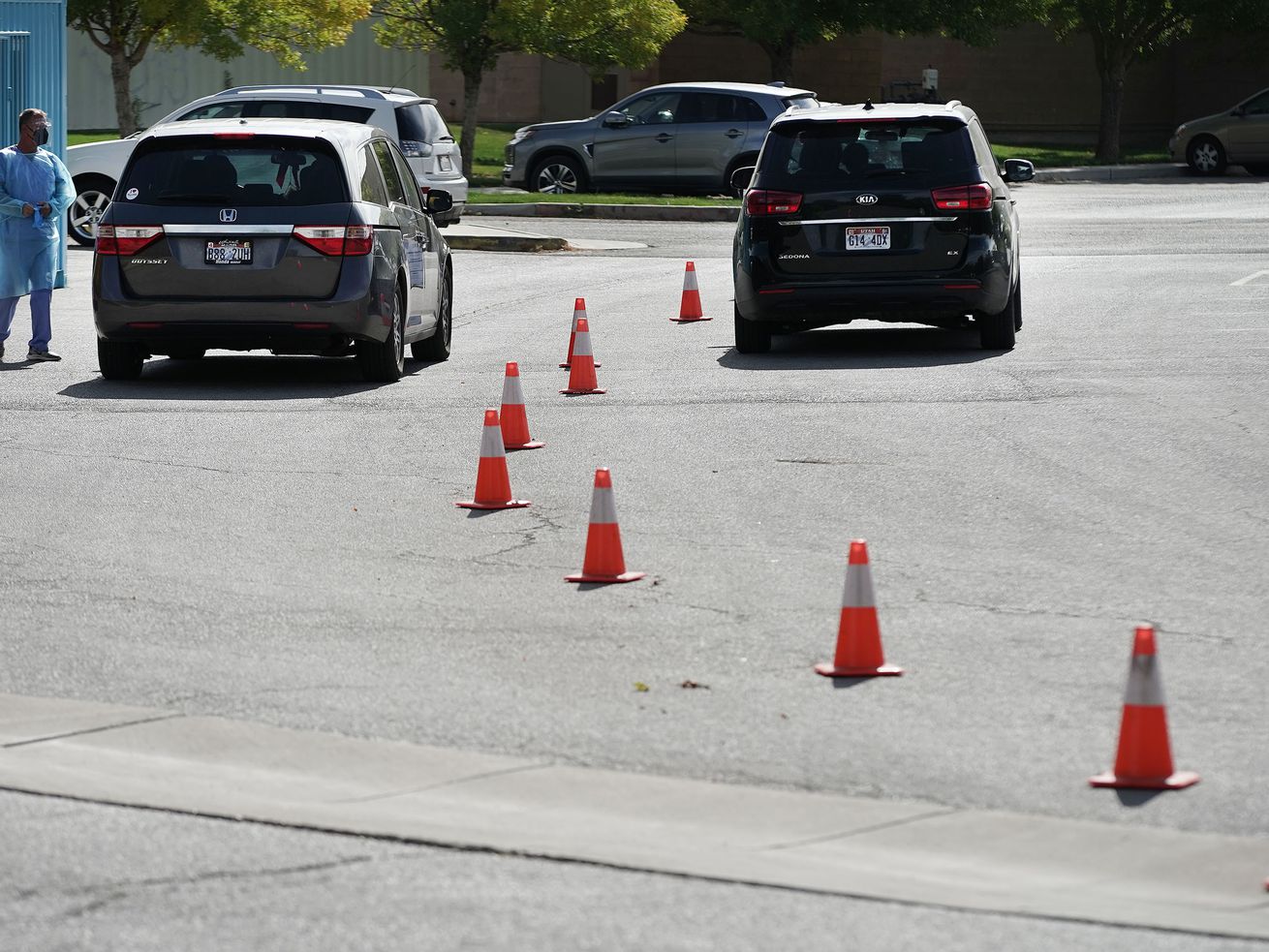 COVID-19 testing is performed for two individuals at the Mount Olympus Senior Center parking lot in Millcreek on
Tuesday, Oct. 5. Utah health officials confirmed 1,253 new COVID-19 cases and eight deaths on Thursday.