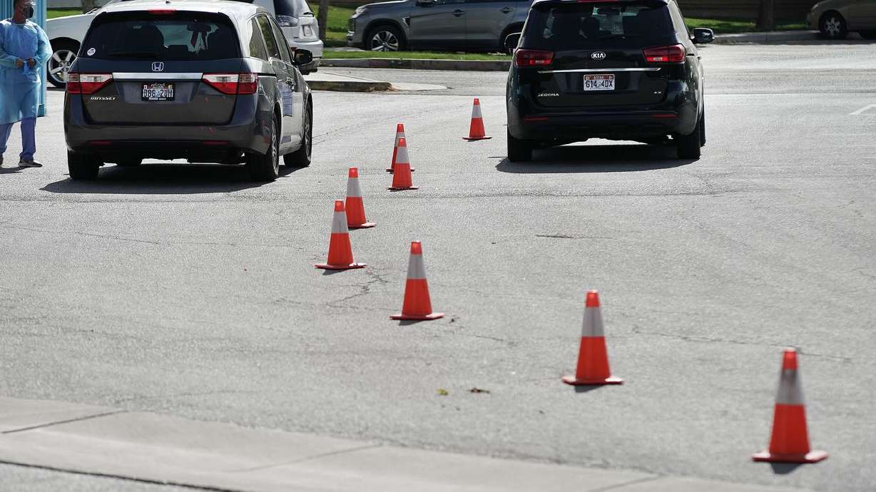 COVID-19 testing is performed for two individuals at the Mount Olympus Senior Center parking lot in Millcreek on Oct. 5.