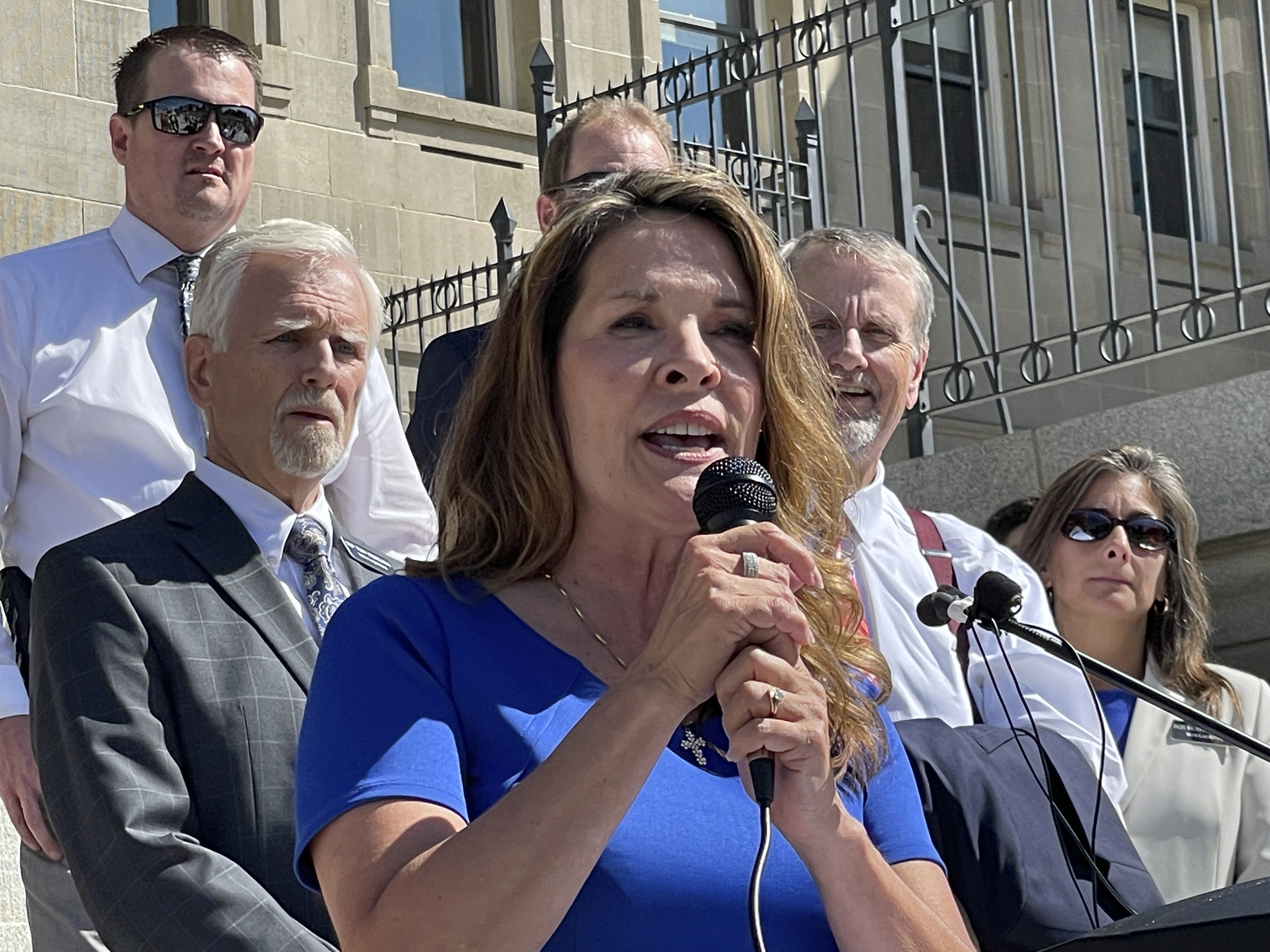 Republican Lt. Gov. Janice McGeachin addresses a rally on the Statehouse steps in Boise on Sept. 15. Mainstream Idaho Republicans concerned about a takeover by the surging far-right wing of the party are asking Democrats, Independents or other affiliated voters to register as Republicans to vote in the party's May primary. 