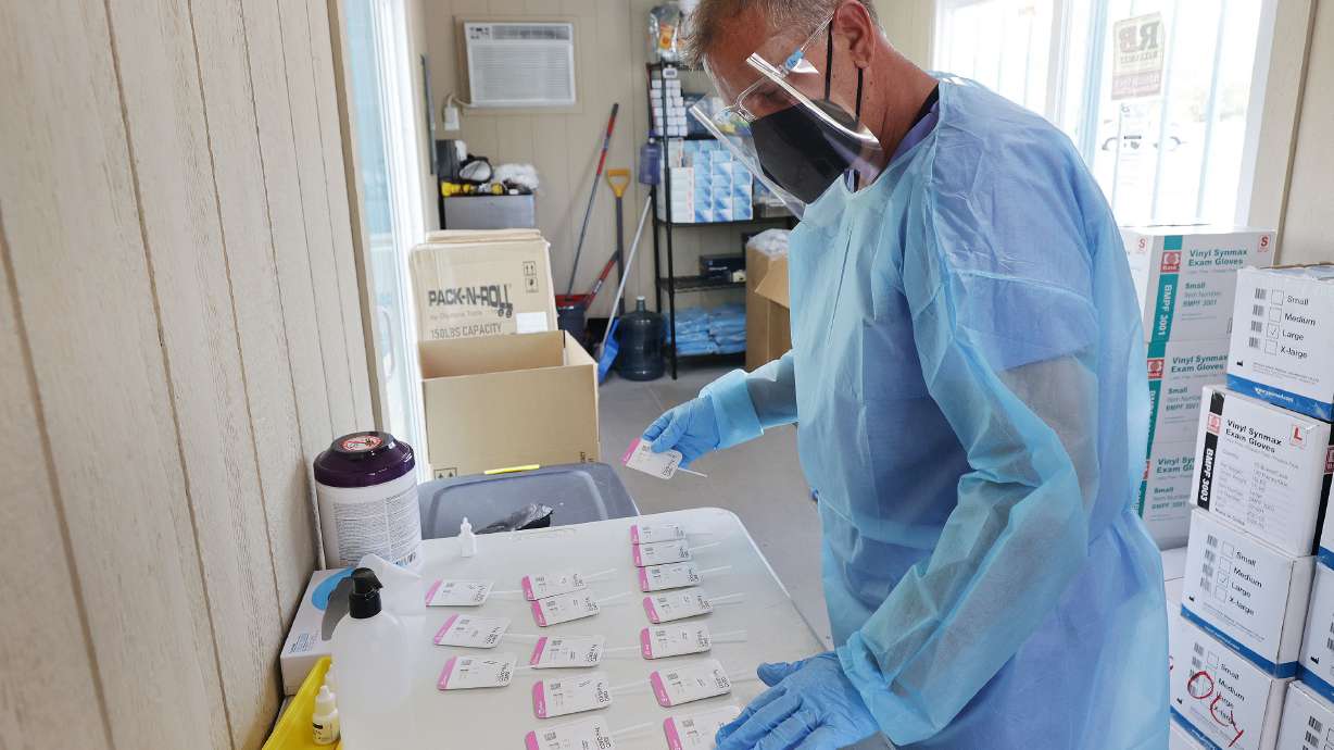 COVID-19 tests are processed at the Mount Olympus Senior Center parking lot in Millcreek on Oct. 5. Utah health officials confirmed 1,493 new COVID-19 cases on Friday, as well as 17 deaths.