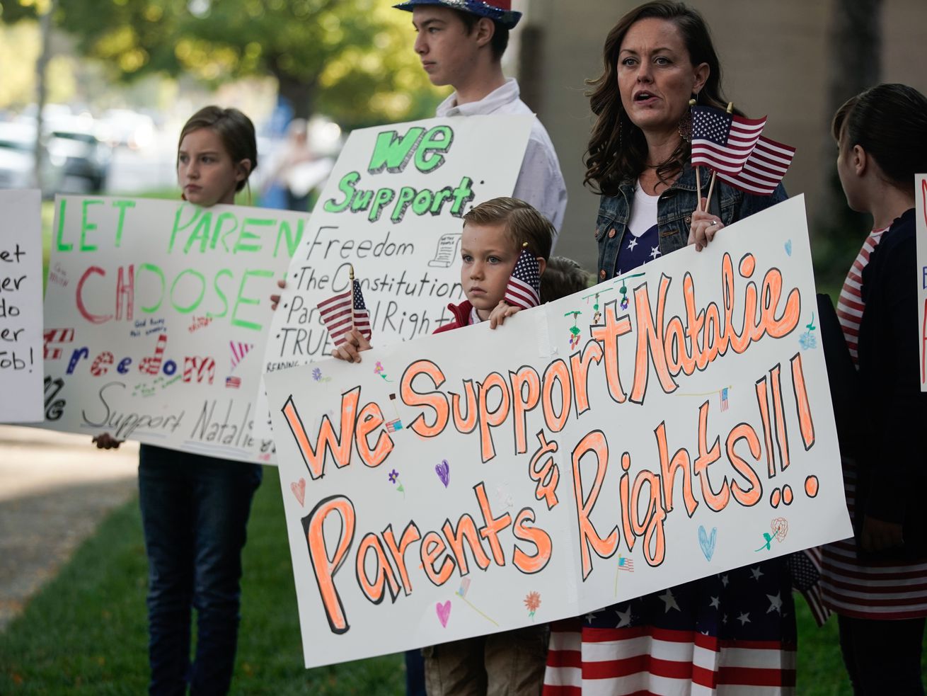 People take part a rally in support of Utah Board of
Education member Natalie Cline in Salt Lake City on Thursday.