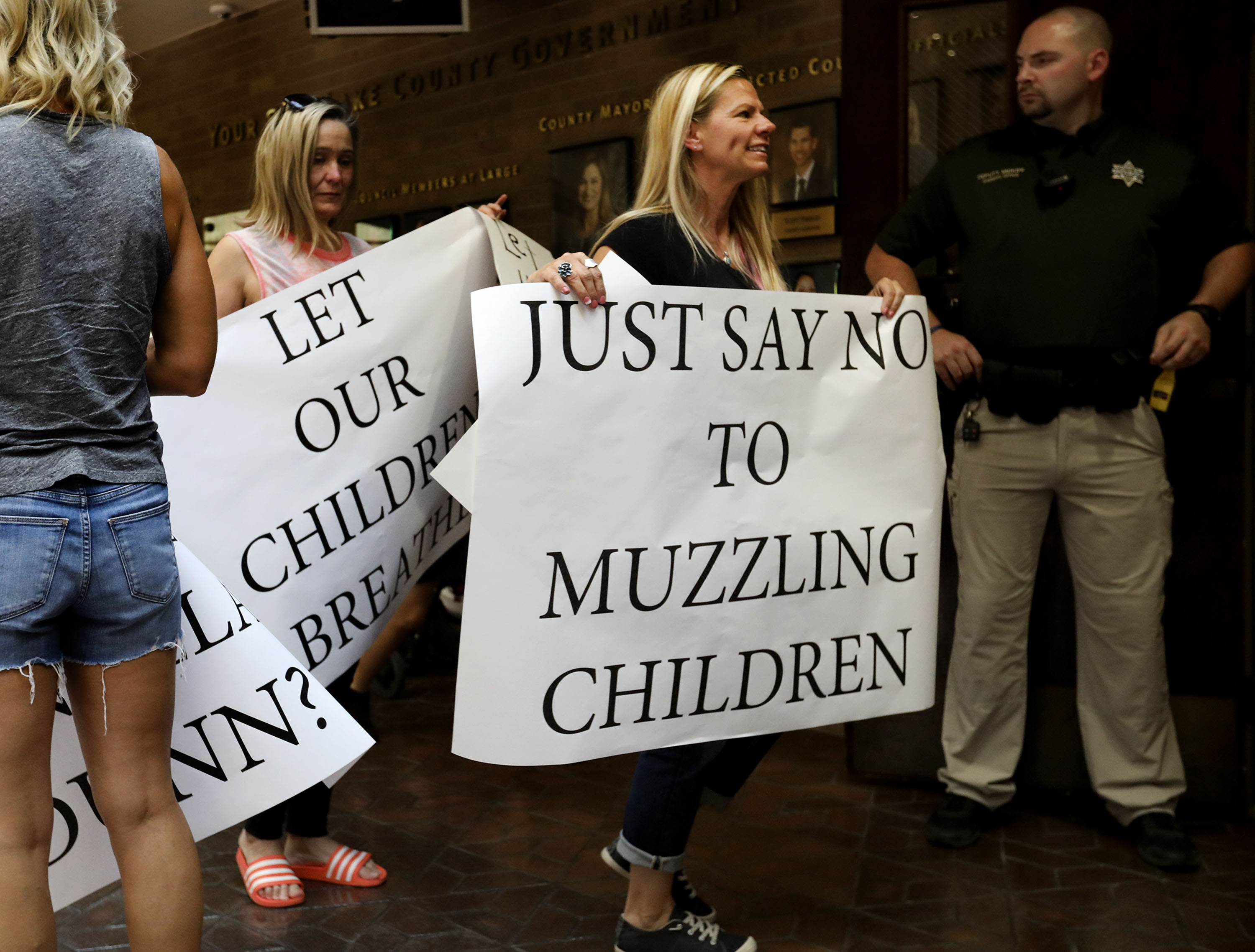 People enter a Salt Lake County Council meeting at the Salt Lake County Government Center in Salt Lake City on Thursday, Aug. 12, 2021, where council members voted to overturn the health department’s “order of restraint” that would have required K-6 students to wear masks when school starts. The proposal to overturn the order passed 6-3 along party lines, with Republicans voting to overturn the order.