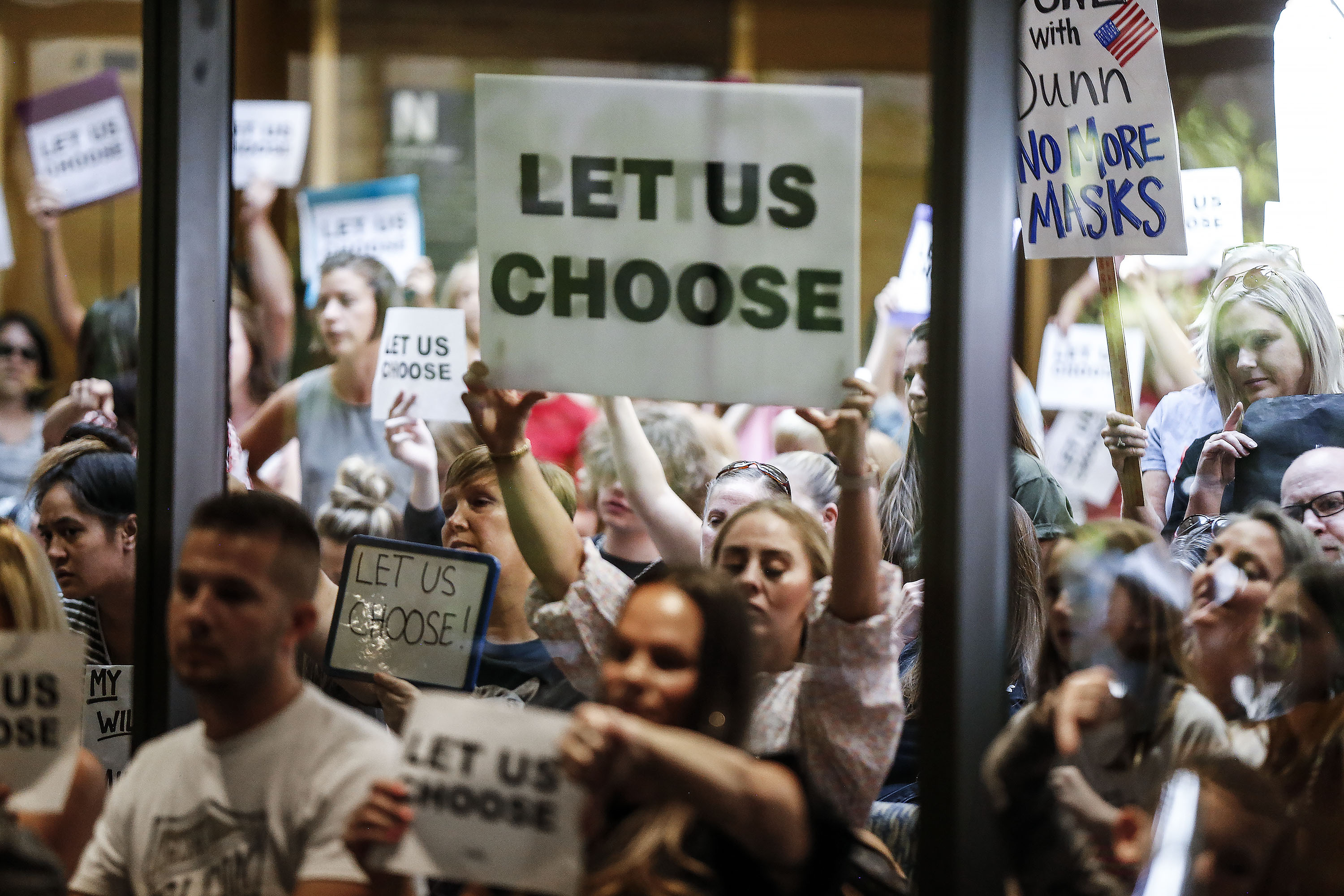 People attend a Salt Lake County Council meeting at the Salt Lake County Government Center in Salt Lake City on Thursday, Aug. 12, 2021, where council members voted to overturn the health department’s “order of restraint” that would have required K-6 students to wear masks when school starts. The proposal to overturn the order passed 6-3 along party lines, with Republicans voting to overturn the order.