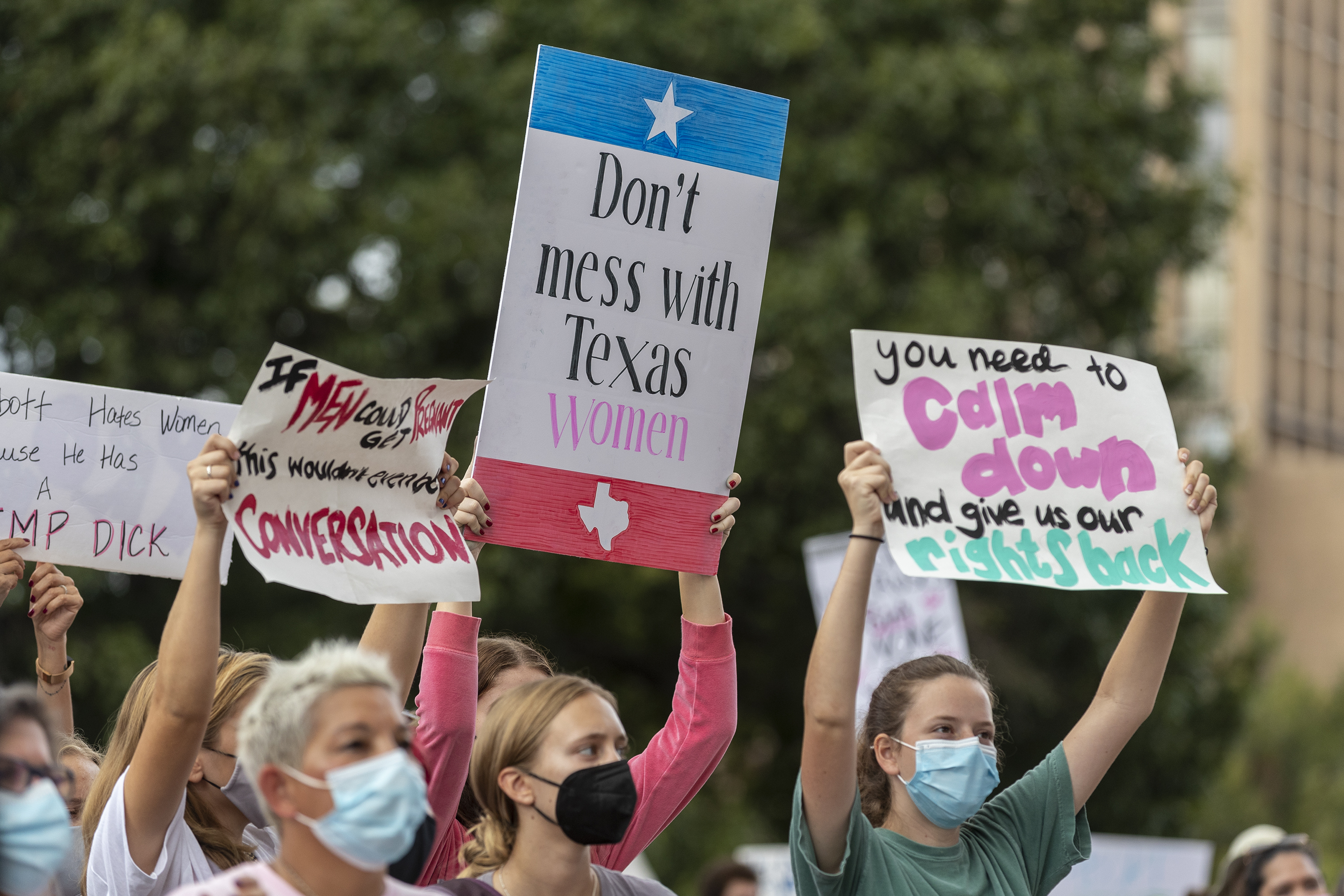 People attend the Women's March ATX rally, at the Texas State Capitol in Austin, Texas, on Oct. 2. A federal judge has ordered Texas to suspend a new law that has banned most abortions in the state since September. The order Wednesday by U.S. District Judge Robert Pitman freezes for now the strict abortion law known as Senate Bill 8. 