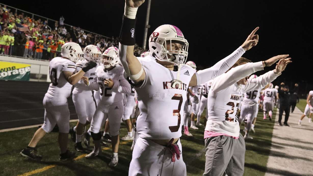 Lone Peak players begin to celebrate as a win against Corner Canyon looks imminent during a high school football game at Corner Canyon High School in Draper on Thursday, Oct. 7, 2021.
