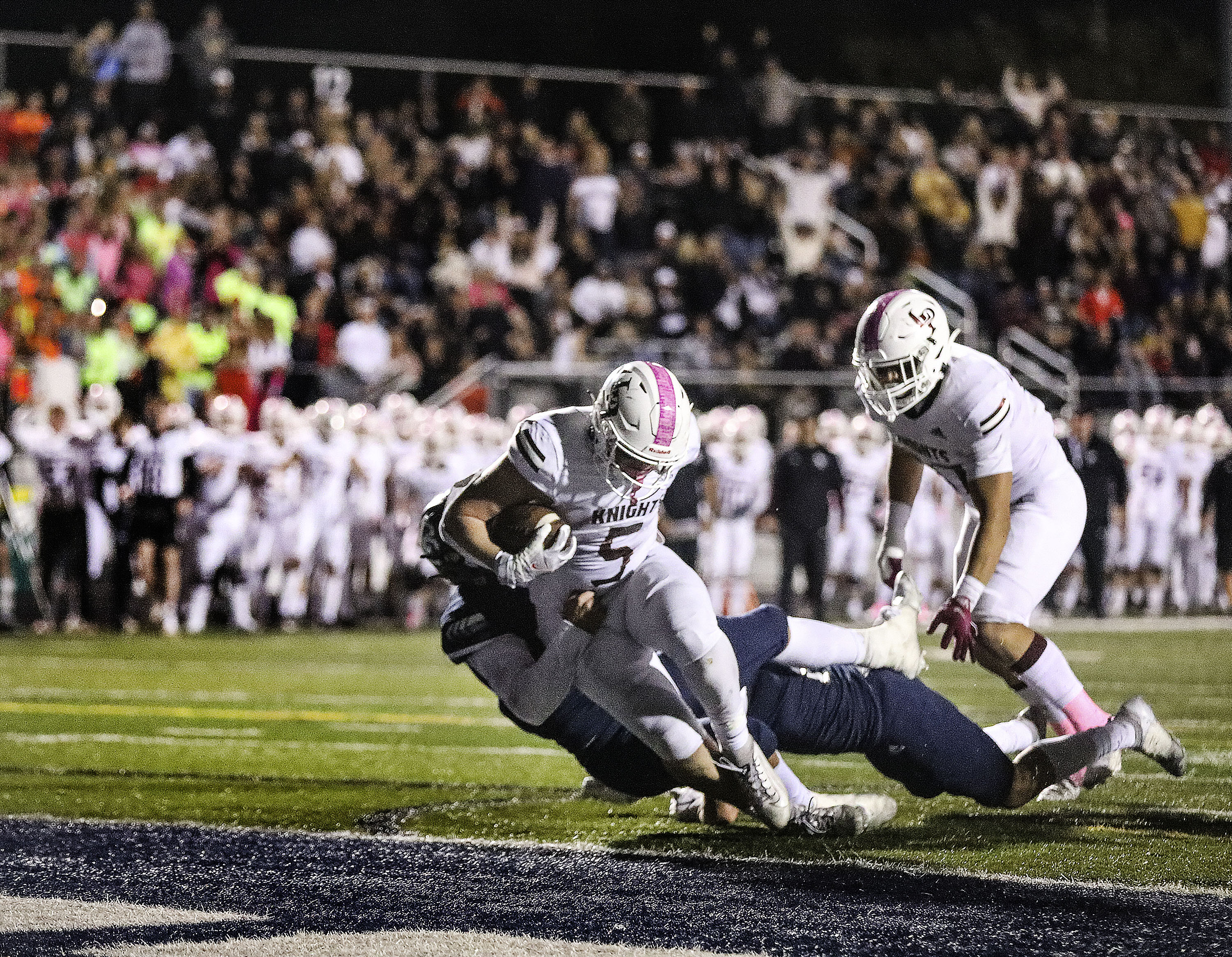 Lone Peak's Luke Durfey reaches for the goal line against Corner Canyon at Corner Canyon High School in Draper on Thursday, Oct. 7, 2021.