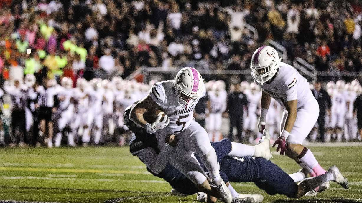 Lone Peak's Luke Durfey reaches for the goal line against Corner Canyon at Corner Canyon High School in Draper on Thursday, Oct. 7, 2021.