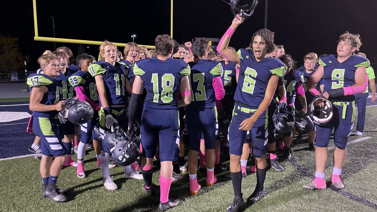 Timpanogos celebrates after a 48-34 victory over Tooele in the team's final home game of the regular season on Oct. 7, 2021.