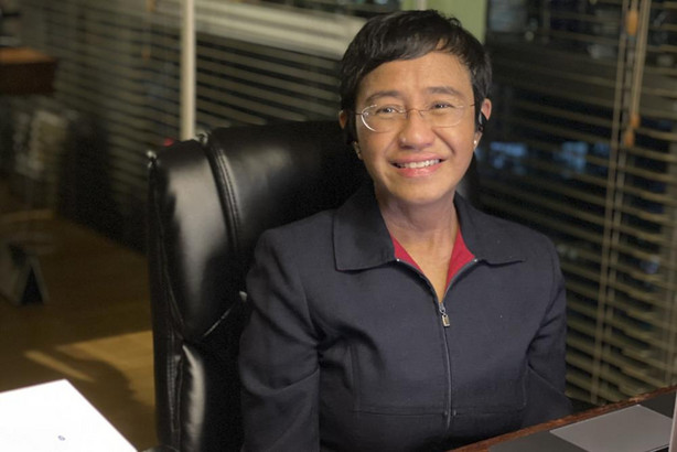 In this photo provided by the Rappler, Rappler CEO and Executive Editor Maria Ressa reacts after hearing of her winning the Nobel Peace Prize inside her home in Taguig, Metro Manila, Philippines, Friday. The Nobel Peace Prize was awarded to journalists Maria Ressa of the Philippines and Dmitry Muratov of Russia for their fight for freedom of expression.