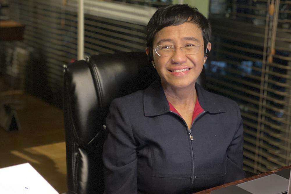 In this photo provided by the Rappler, Rappler CEO and Executive Editor Maria Ressa reacts after hearing of her winning the Nobel Peace Prize inside her home in Taguig, Metro Manila, Philippines, Friday. The Nobel Peace Prize was awarded to journalists Maria Ressa of the Philippines and Dmitry Muratov of Russia for their fight for freedom of expression.