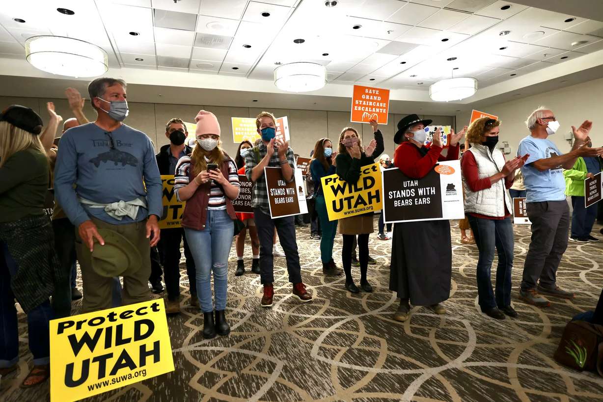 Southern Utah Wilderness Alliance members gather in a ballroom at the Radisson Hotel in Salt Lake City on Friday to watch a television broadcast of President Joe Biden, as he restored Bears Ears and Grand Staircase-Escalante national monuments to their original boundaries in a White House ceremony.