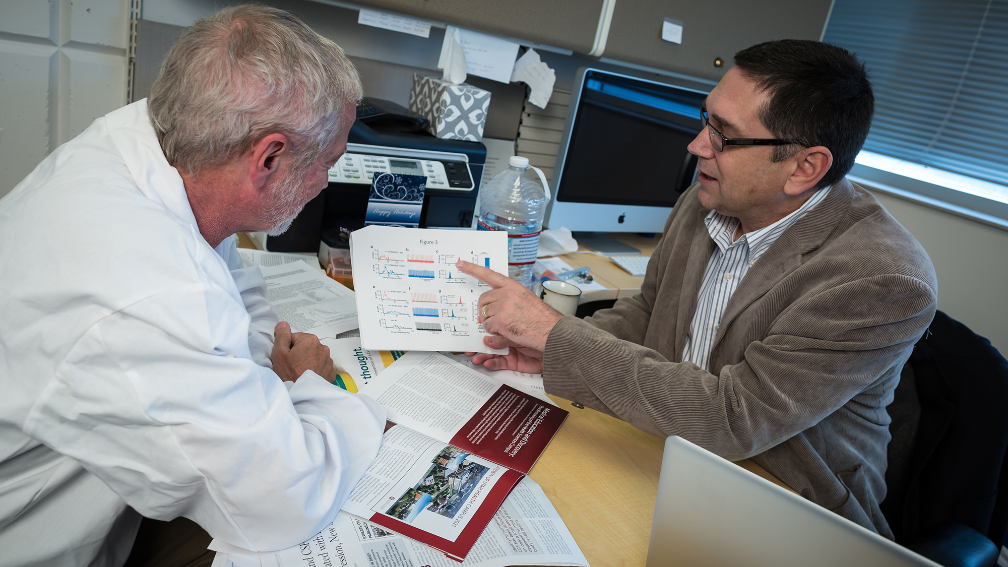 Daniel Scoles, associate professor of neurology, and Stefan Pulst, chair of neurology, discuss a newly identified molecule that could help treat Parkinson's and slow its progression.