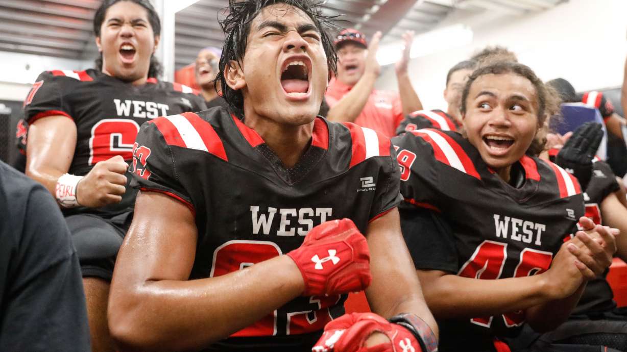 West’s Shemiah Collins cheers with his teammates before a high school football game against Roy High on Friday, Sept. 10, 2021, at West High School in Salt Lake City.