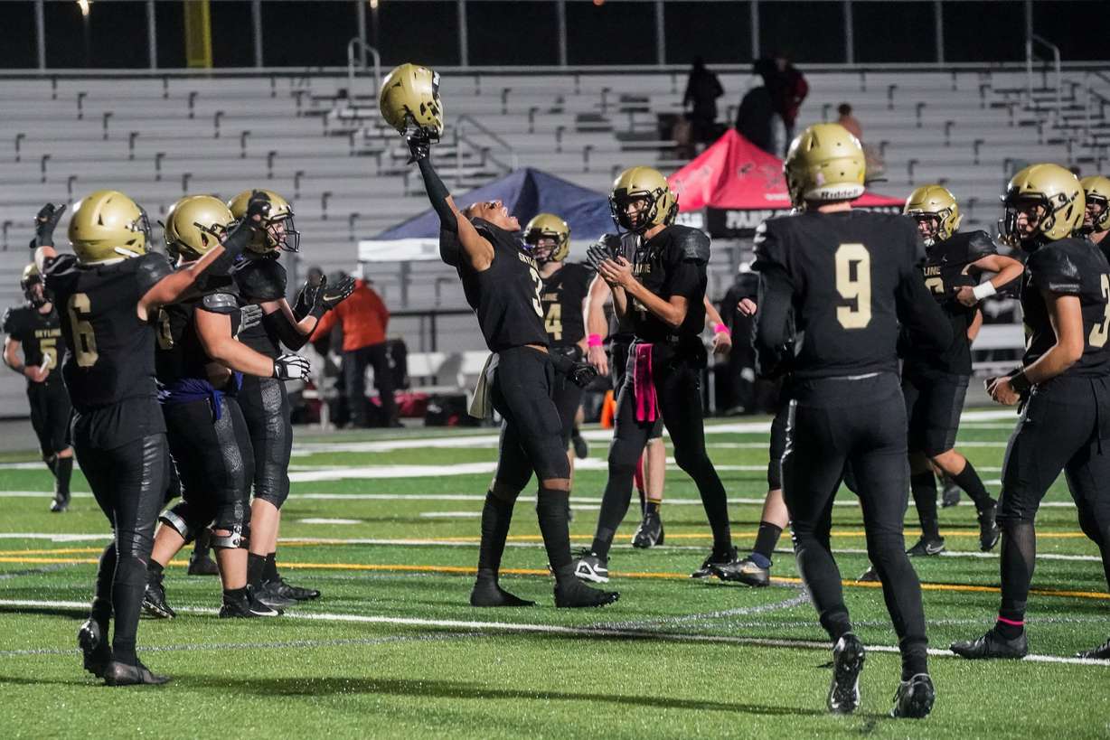 Skyline players celebrate their victory after a high school football game against Park City at Skyline High School in Salt Lake City on Friday, Oct. 8, 2021. Skyline won 10-6.