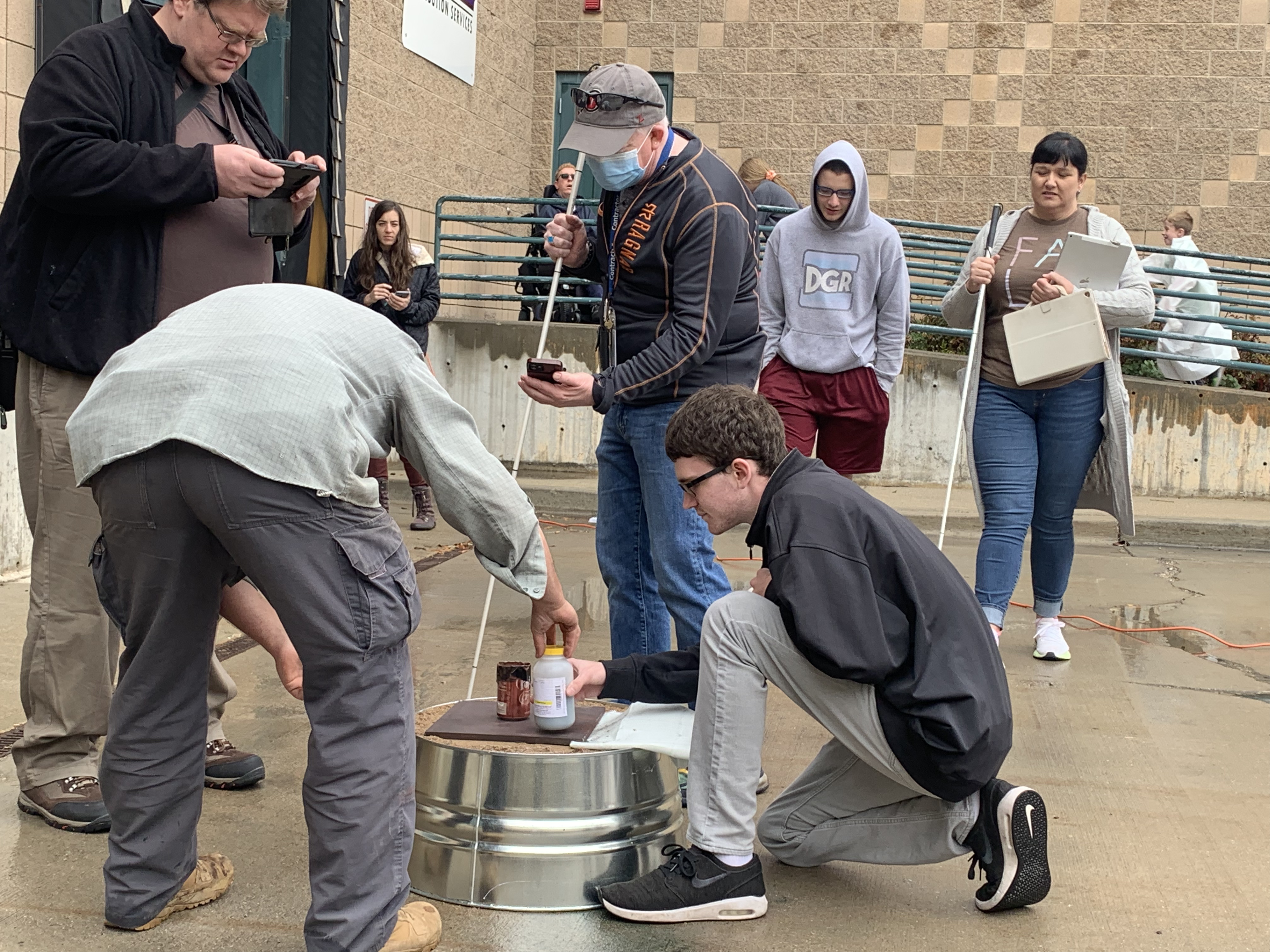 Blind students with Project STRIVE do a science experiment using adaptive technology on Saturday.