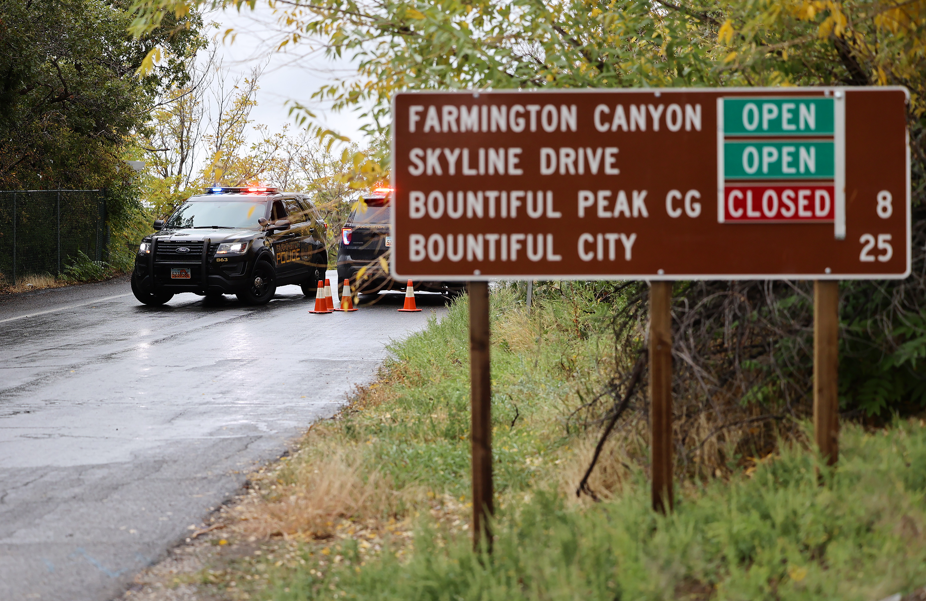 Farmington police officers block the road up Farmington Canyon on Saturday. Approximately 87 individuals participating in an ultra-marathon in the mountains above Davis County were caught in about 12-18 inches of snow and near whiteout conditions. 