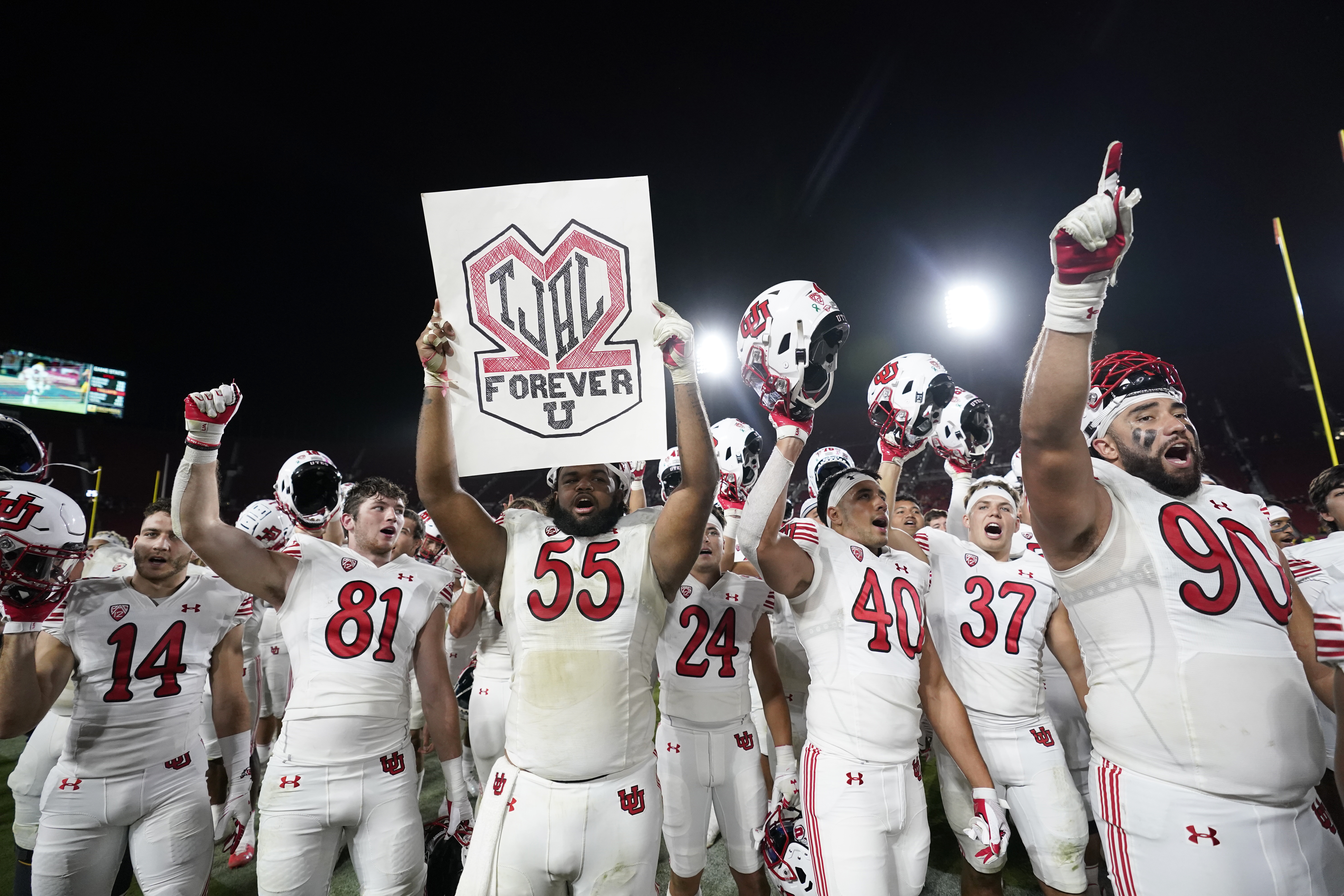 Utah players celebrate a win over Southern California in an NCAA college football game Saturday, Oct. 9, 2021, in Los Angeles.