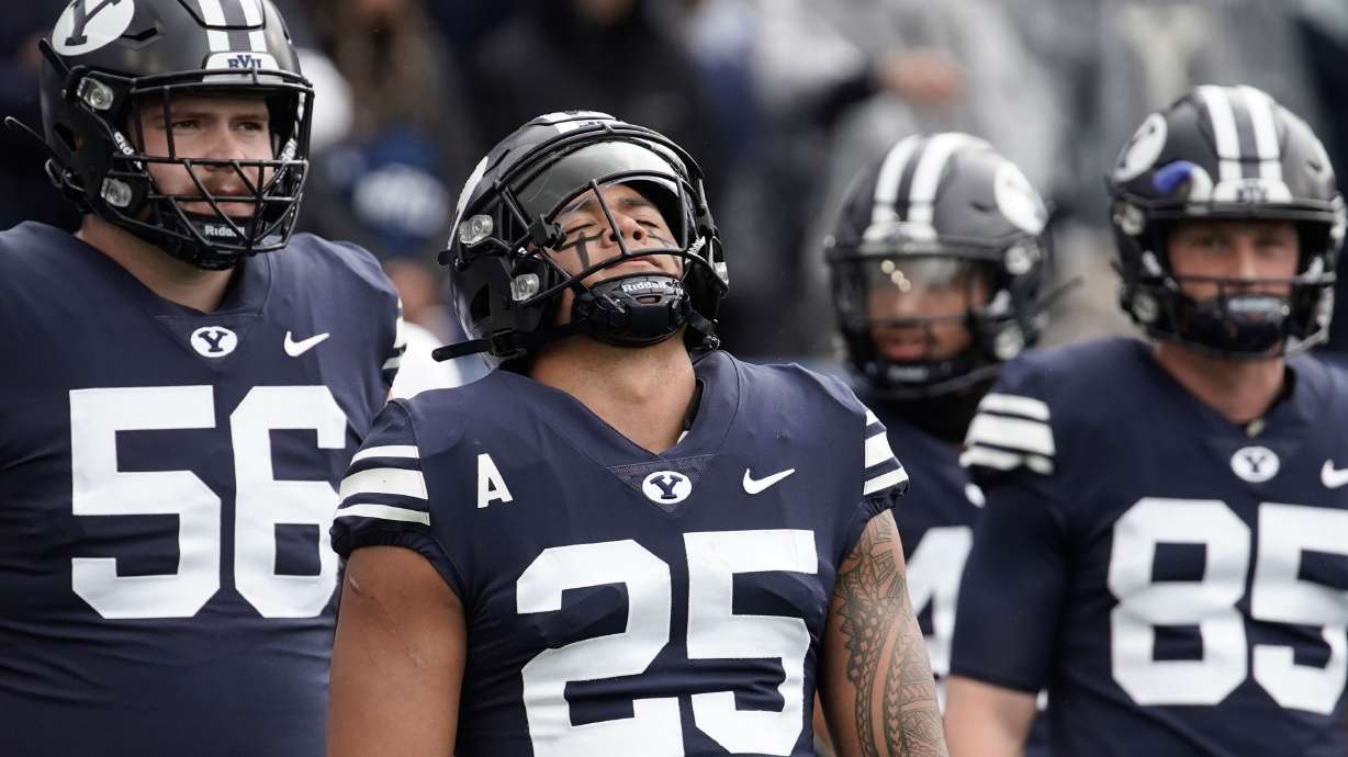 BYU running back Tyler Allgeier (25) closes his his eyes as he warms up ahead of an NCAA college football game against Boise State at LaVell Edwards Stadium in Provo on Saturday, Oct. 9, 2021.