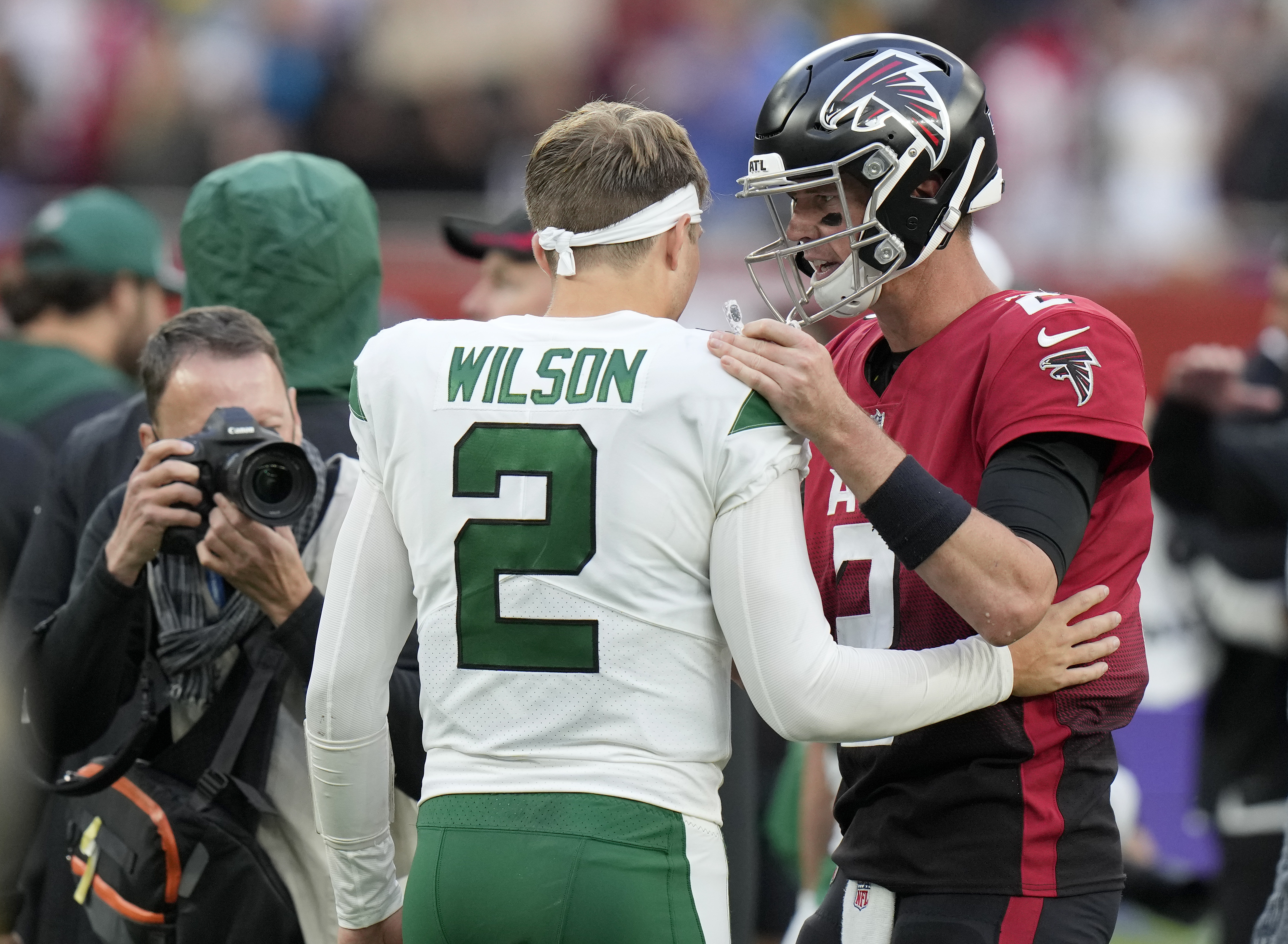 Atlanta Falcons quarterback Matt Ryan (2) greets New York Jets quarterback Zach Wilson (2) after an NFL football game between the New York Jets and the Atlanta Falcons at the Tottenham Hotspur stadium in London, England, Sunday, Oct. 10, 2021. Atlanta Falcons won the match 27-20.